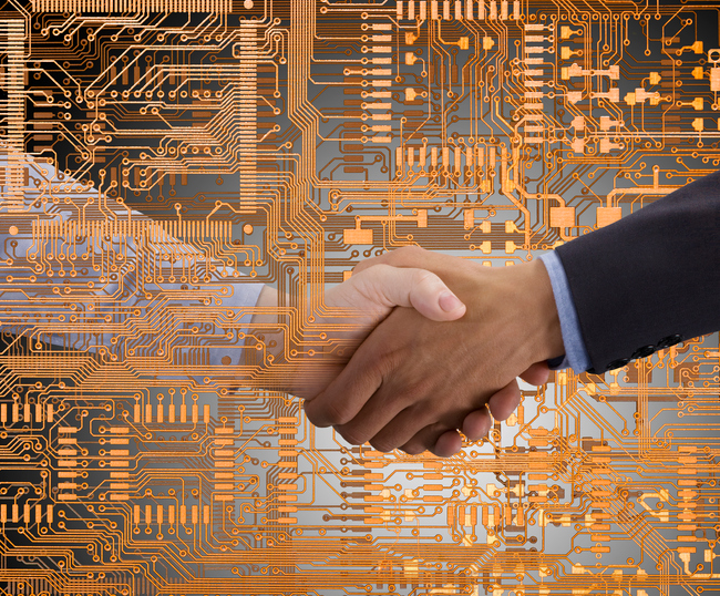 Business people shaking hands in microchip