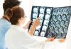 Researchers Link OGDHL and NRD1 Genes to Neurologic Disorders Doctors Looking At MRI Scan Of The Brain