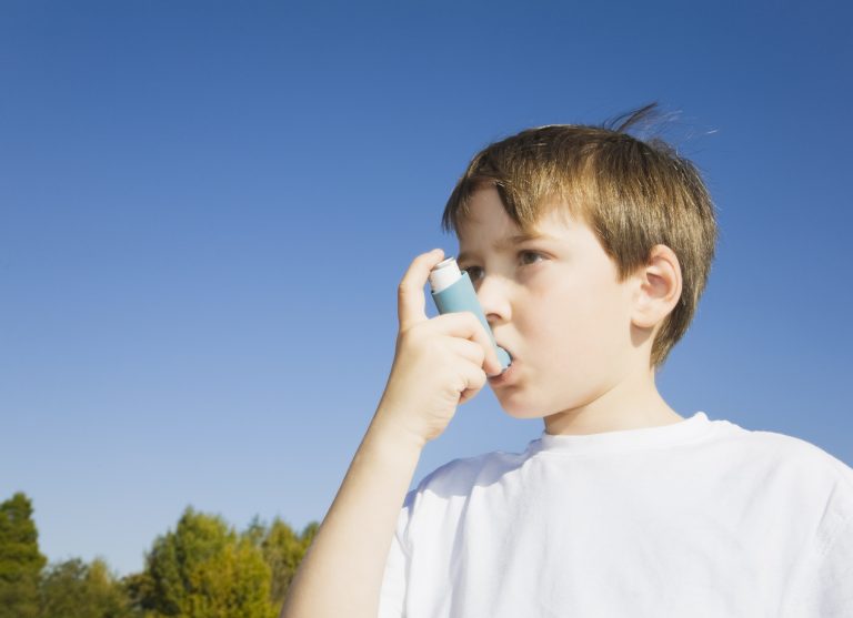 Boy using Inhaler for asthma