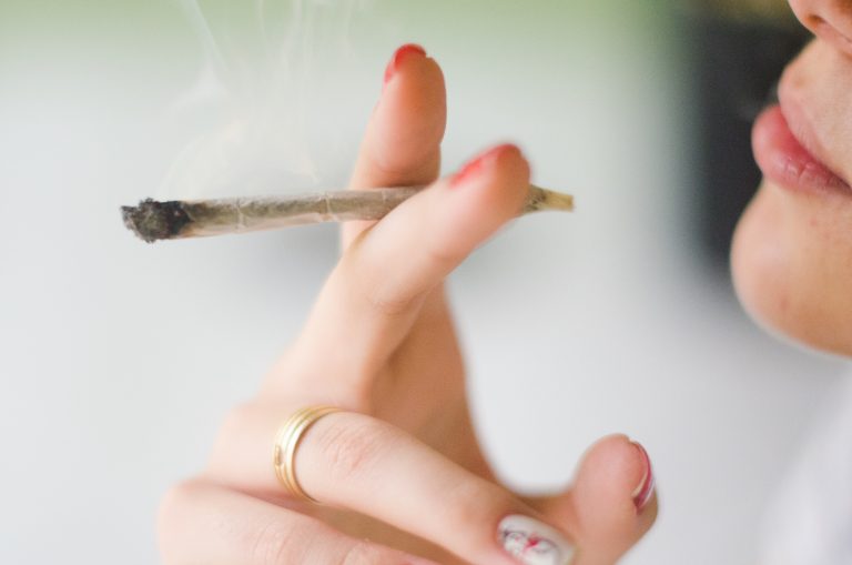 Close-Up Of Woman Smoking Weed