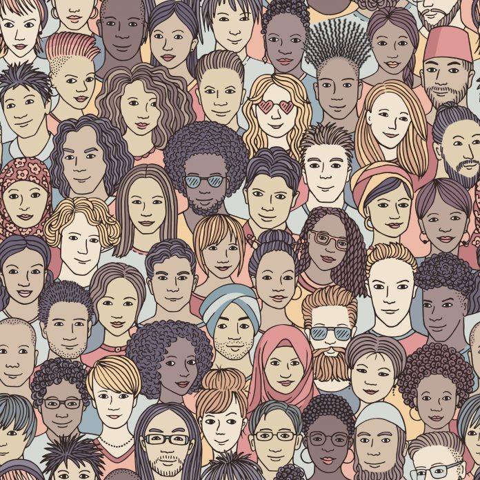 Seamless pattern of hand drawn faces of diverse ethnicities