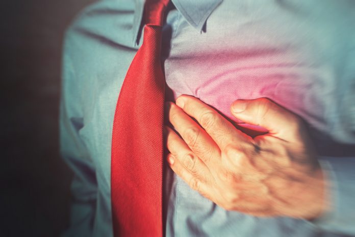 Unrecognizable businessman having chest pain and heart attack