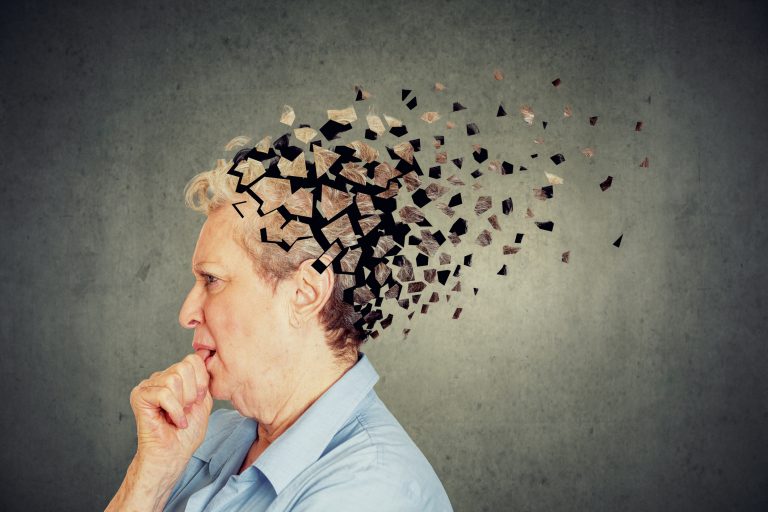 Image of older woman losing parts of the back of her head and looking confused as symbol of decreased mind function in dementia.