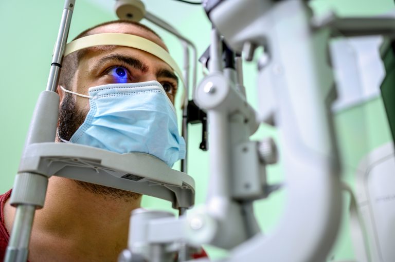 Man having an eye exam at ophthalmologist's office