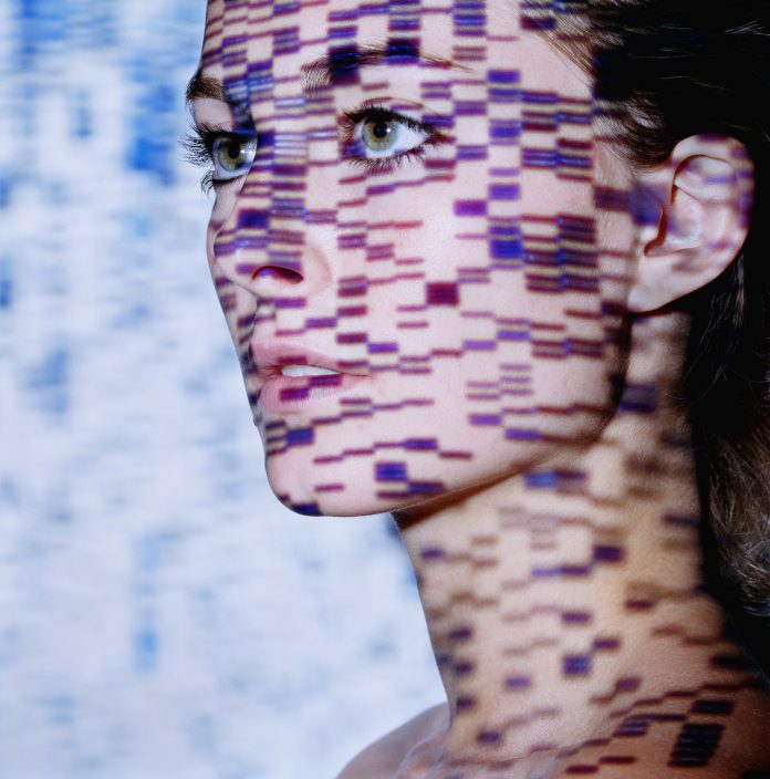 Young woman, DNA gels projected onto face