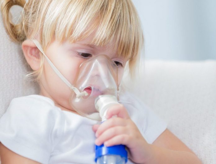 Little girl receives breathing treatment