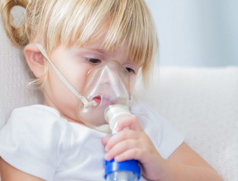 Little girl receives breathing treatment