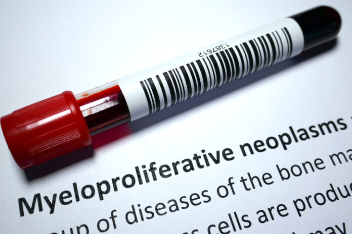 Test tube with blood in on top of paper with a subtitle reading Myeloproliferative neoplasms